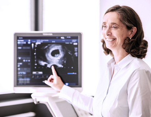 Doctor looking at an ultrasound scan on the monitor Doctor looking at an ultrasound scan on the monitor